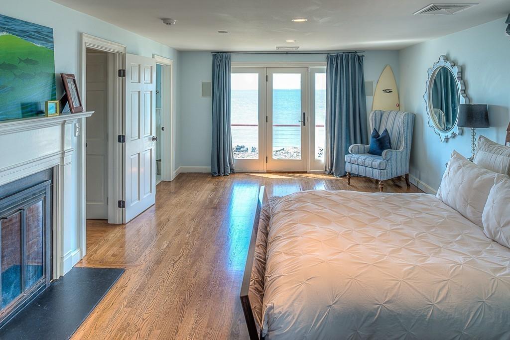 201 Ocean Avenue Marblehead, MA 01945 - Photo 13 of 21 a spacious bedroom with a bed and a large window