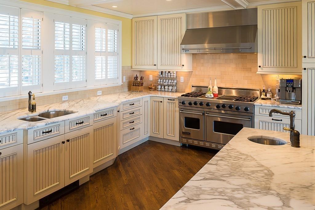 201 Ocean Avenue Marblehead, MA 01945 - Photo 5 of 21 a kitchen with stainless steel appliances granite countertop a stove sink and cabinets
