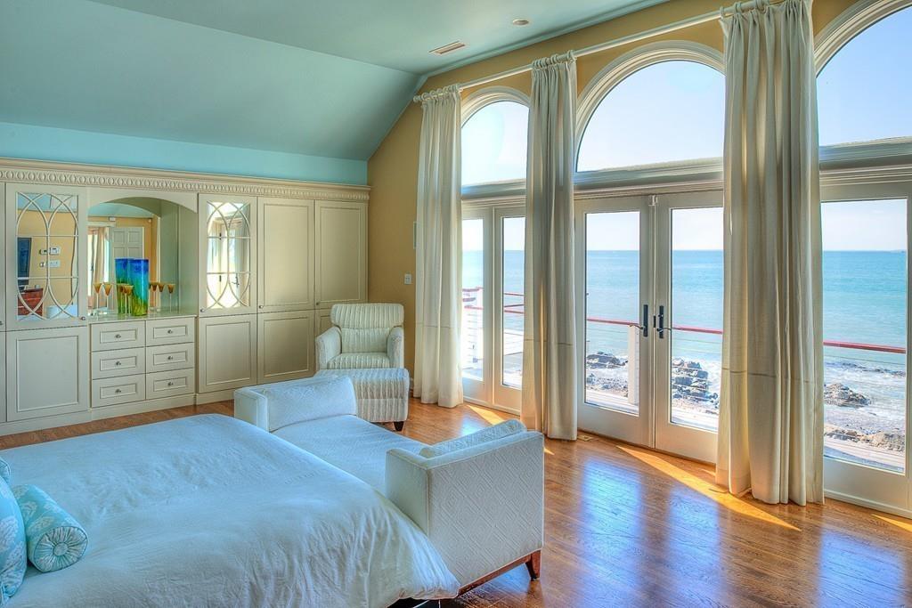 201 Ocean Avenue Marblehead, MA 01945 - Photo 10 of 21 a bedroom with a large bed and a large window