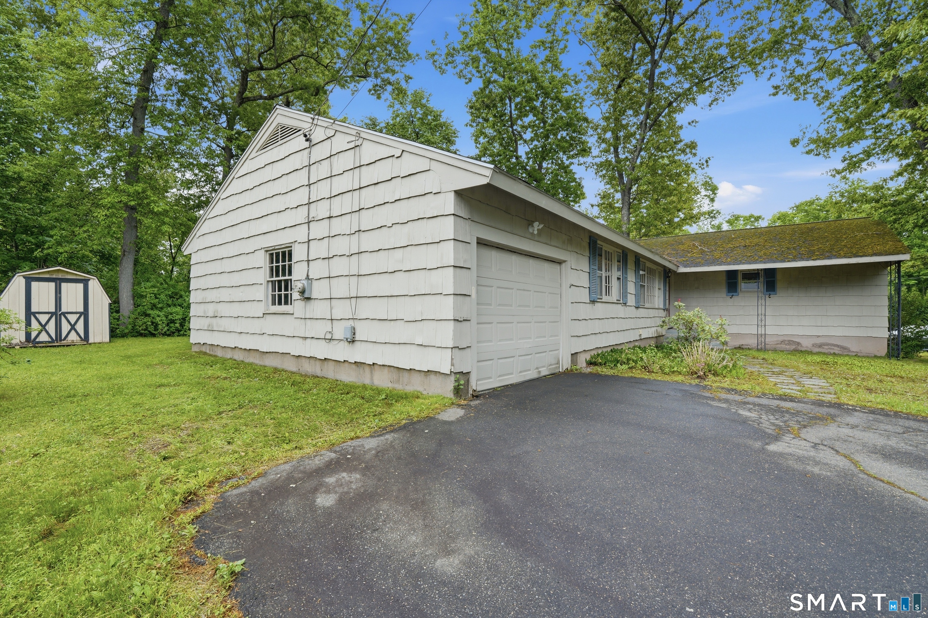 731 Still Hill Road Hamden, CT 06518 - Photo 2 of 40 a view of a house with a yard