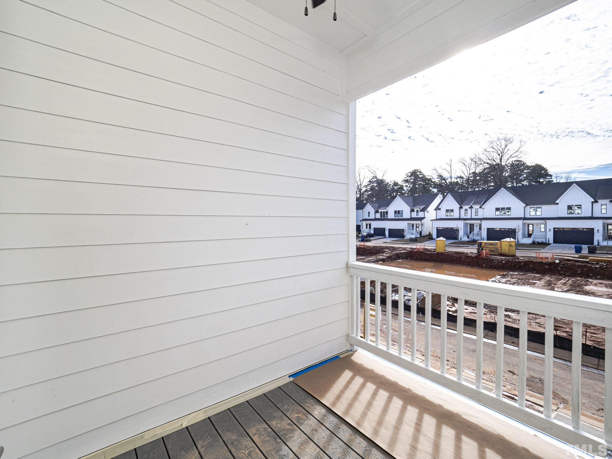 4922 Trek Lane Raleigh, NC 27606 - Photo 15 of 28 a view of a balcony with wooden fence