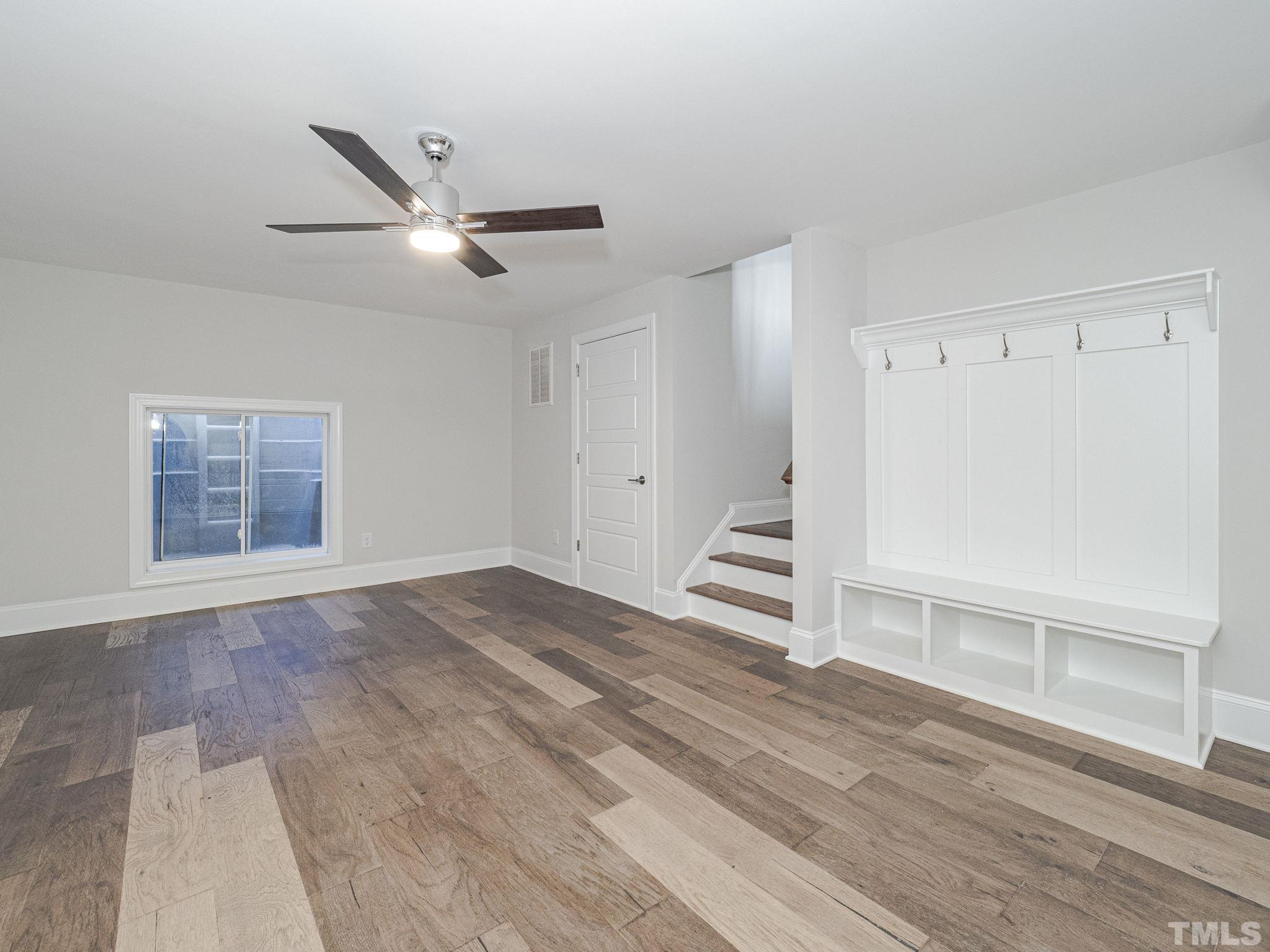 4922 Trek Lane Raleigh, NC 27606 - Photo 24 of 28 wooden floor in an empty room with a window