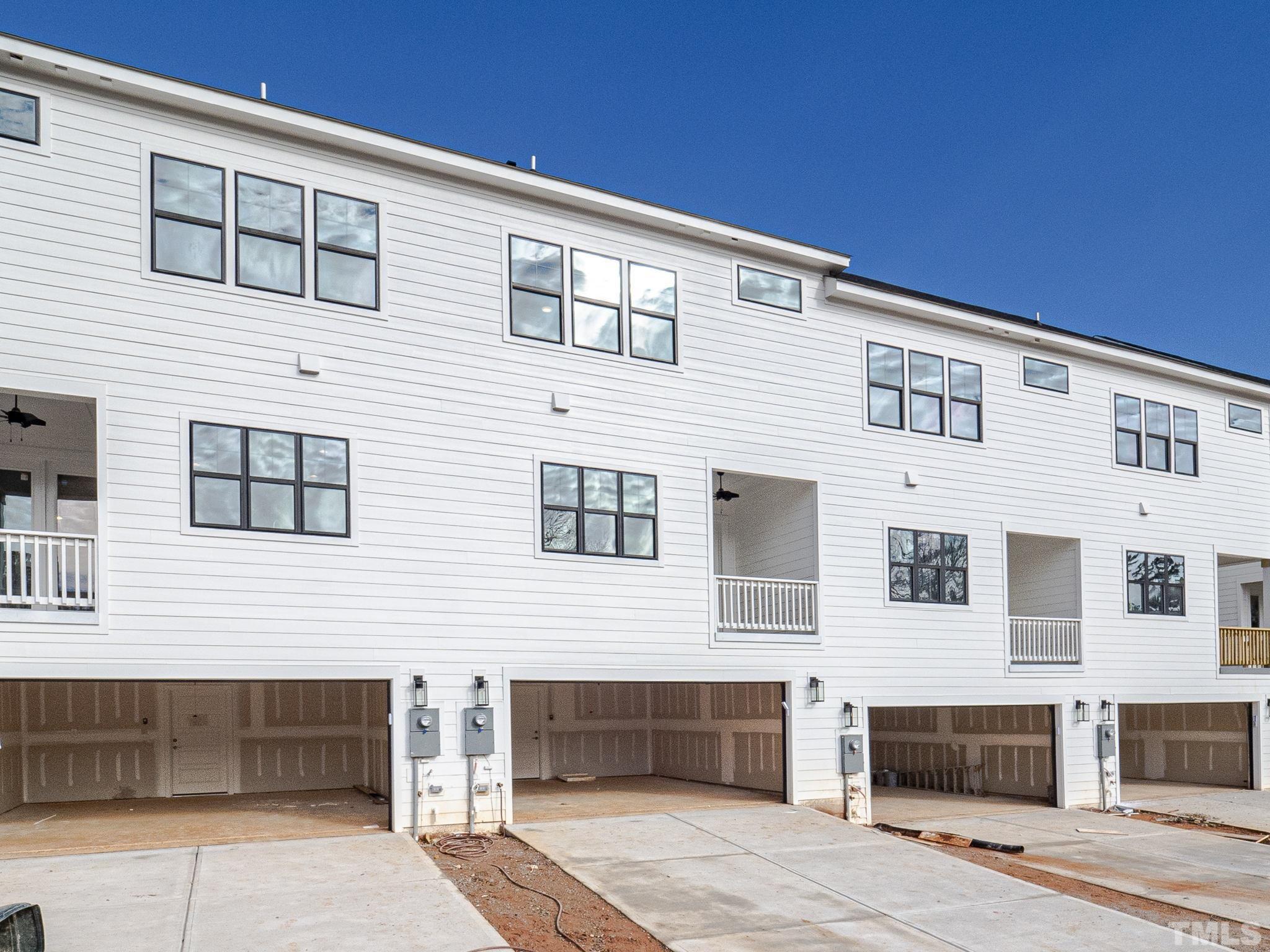 4922 Trek Lane Raleigh, NC 27606 - Photo 26 of 28 a front view of a house with a parking