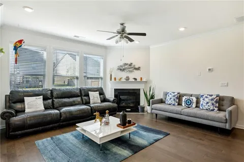 a living room with furniture a fireplace and a table