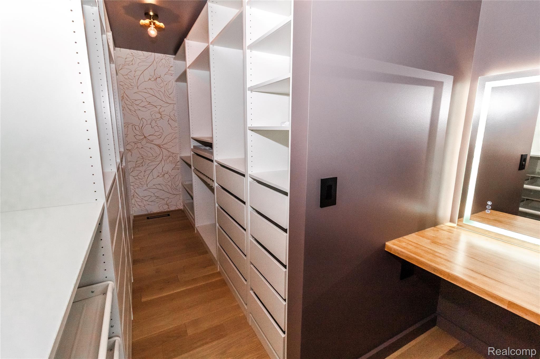 1138 Baldwin Road Lapeer, MI 48446 - Photo 17 of 49 Custom closet system featuring extensive shelving and drawer storage