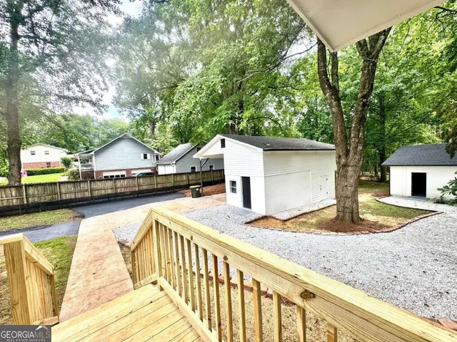 a view of house with swimming pool and sitting area