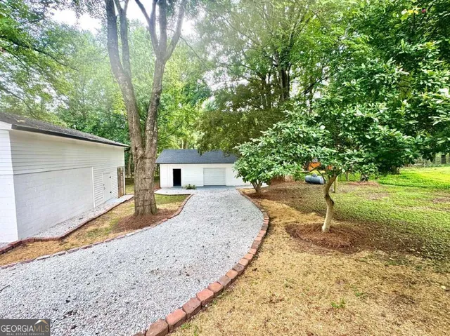 a house view with a backyard space