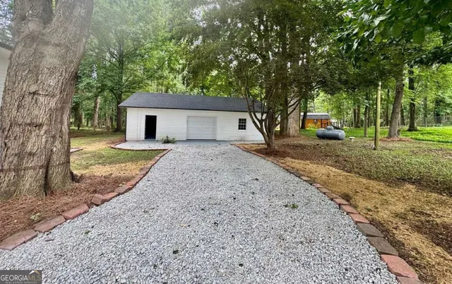 a house with trees in the background