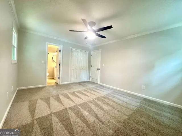 a kitchen with kitchen island a sink stainless steel appliances and cabinets
