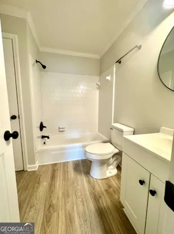 a view of a kitchen cabinets a sink and a microwave