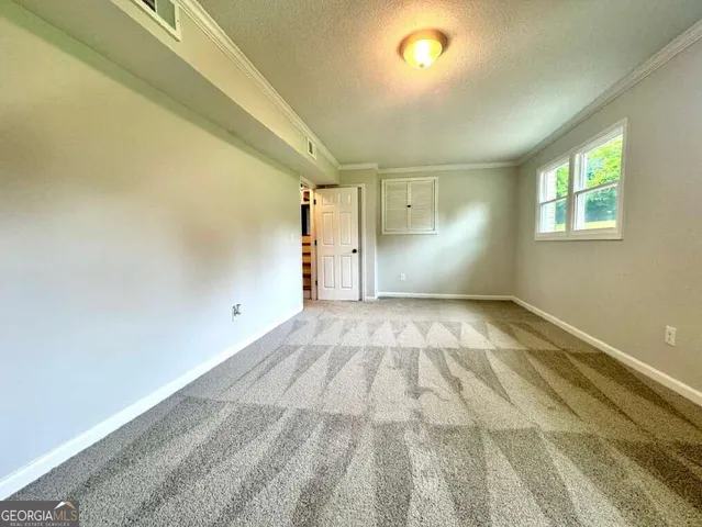 a view of a hallway with a room