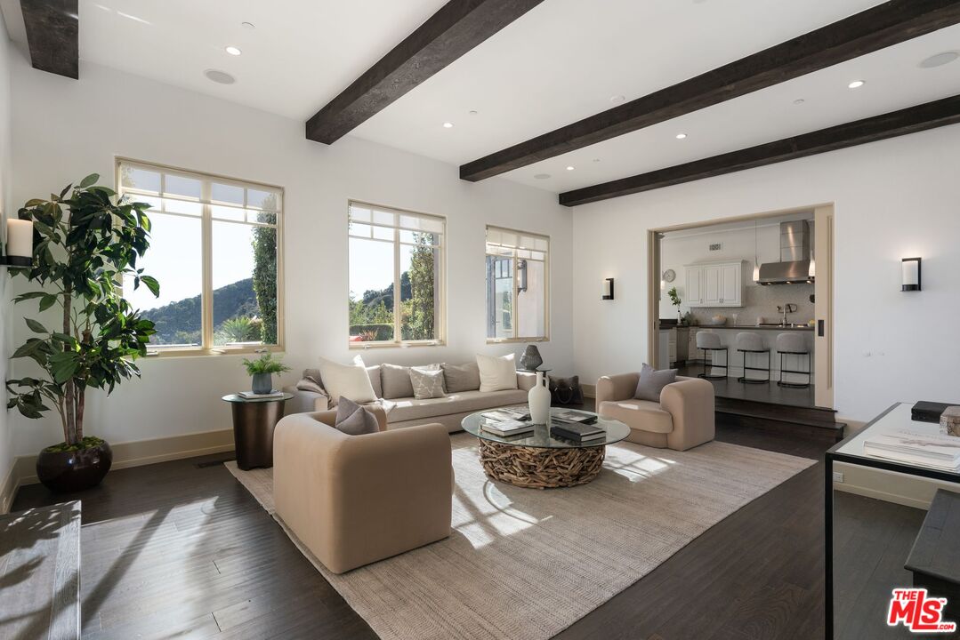 8 Beverly Ridge Terrace Beverly Hills, CA 90210 - Photo 14 of 74 a living room with furniture and a large window