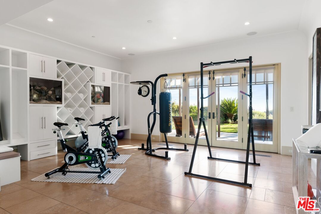 8 Beverly Ridge Terrace Beverly Hills, CA 90210 - Photo 23 of 74 a view of a room with gym equipment