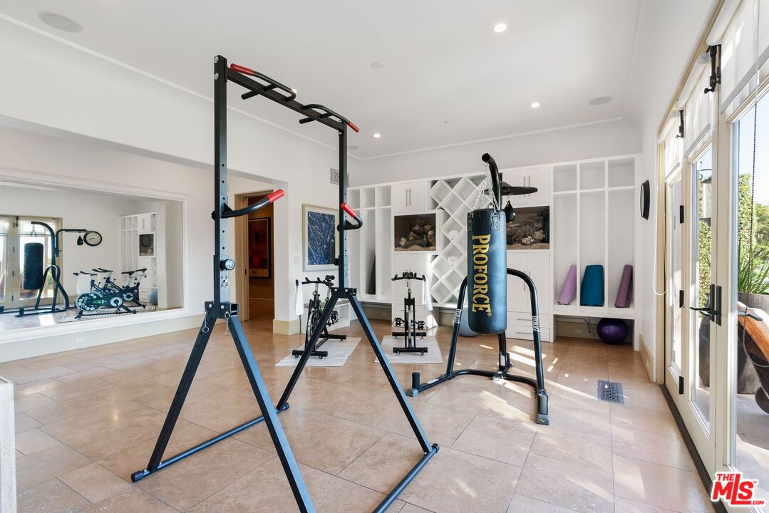 8 Beverly Ridge Terrace Beverly Hills, CA 90210 - Photo 24 of 74 a view of a room with gym equipment