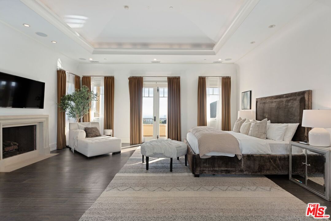 8 Beverly Ridge Terrace Beverly Hills, CA 90210 - Photo 28 of 74 a living room with furniture and a fireplace