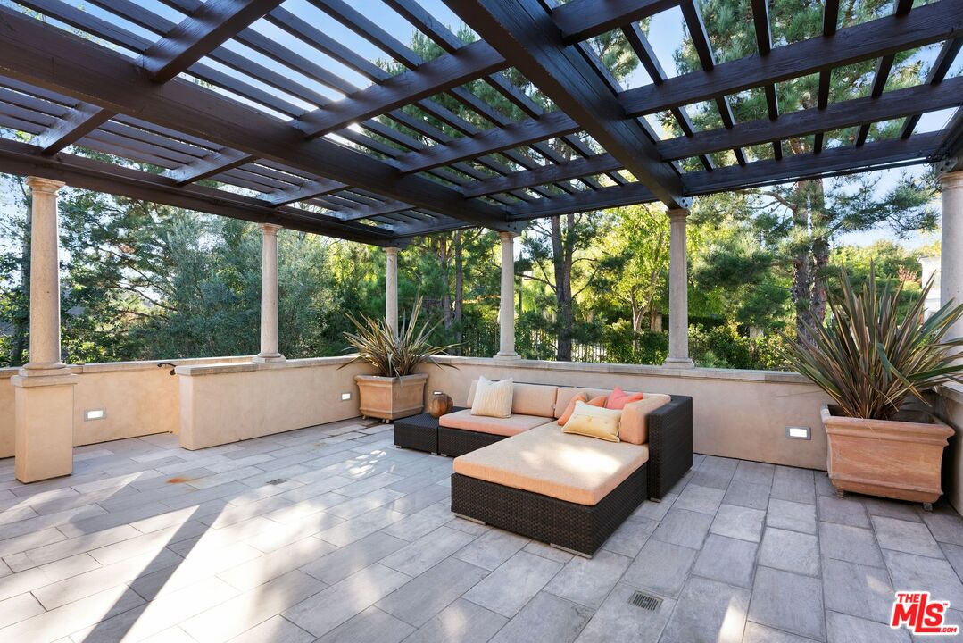8 Beverly Ridge Terrace Beverly Hills, CA 90210 - Photo 45 of 74 a outdoor living space with patio furniture and a potted plant