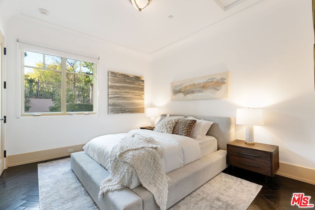 8 Beverly Ridge Terrace Beverly Hills, CA 90210 - Photo 48 of 74 a bedroom with a bed wooden floor and window