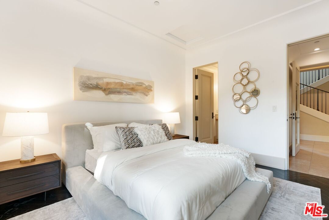 8 Beverly Ridge Terrace Beverly Hills, CA 90210 - Photo 49 of 74 a bedroom with a bed and a couch