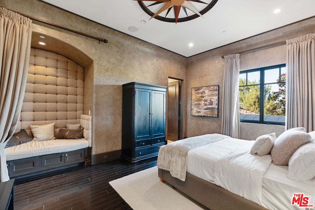 8 Beverly Ridge Terrace Beverly Hills, CA 90210 - Photo 50 of 74 a bedroom with a large bed and a window