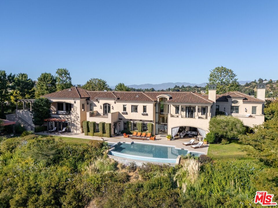 8 Beverly Ridge Terrace Beverly Hills, CA 90210 - Photo 71 of 74 a front view of residential houses with yard and mountain view in back