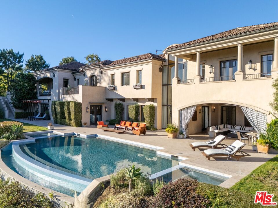 8 Beverly Ridge Terrace Beverly Hills, CA 90210 - Photo 73 of 74 a view of a house with pool and chairs