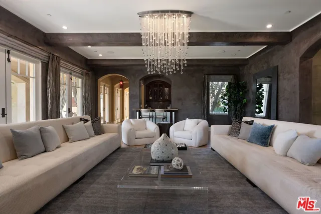 a living room with fireplace furniture and a flat screen tv