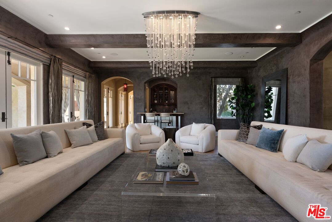 8 Beverly Ridge Terrace Beverly Hills, CA 90210 - Photo 8 of 74 a living room with furniture or chandelier and a large window