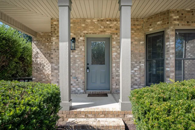 a front view of a house with a glass door