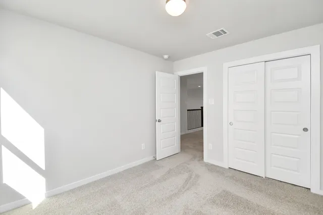 a bathroom with a shower and a sink