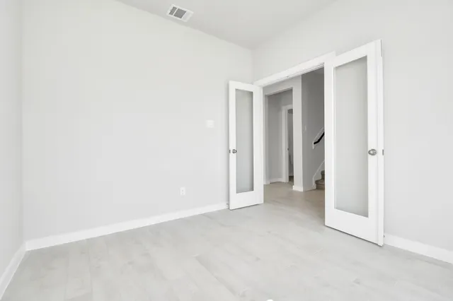 a view of a room with a stylish and entryway