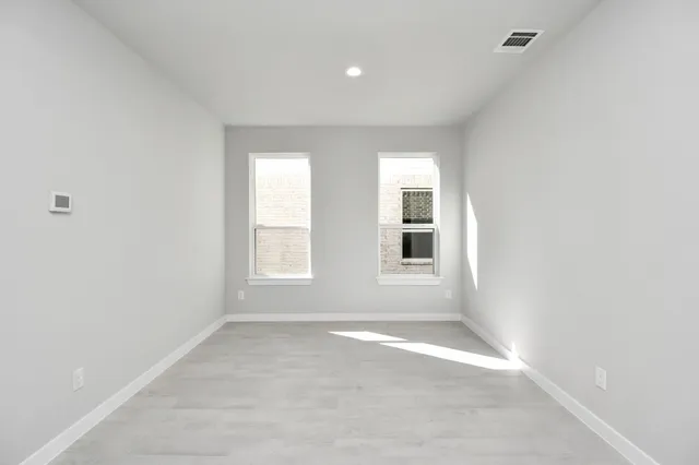 a view of a kitchen island a sink wooden floor and living room