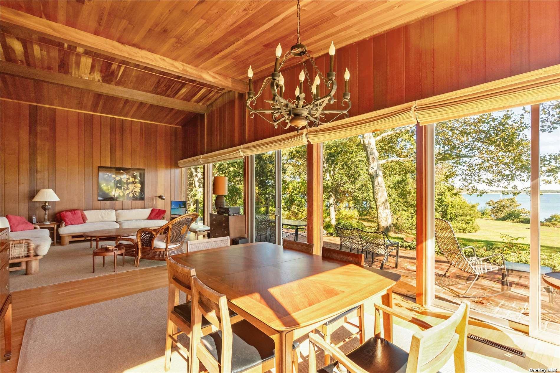 189 Old Harbor Road New Suffolk, NY 11956 - Photo 7 of 26 a outdoor space with lots of tables and chairs