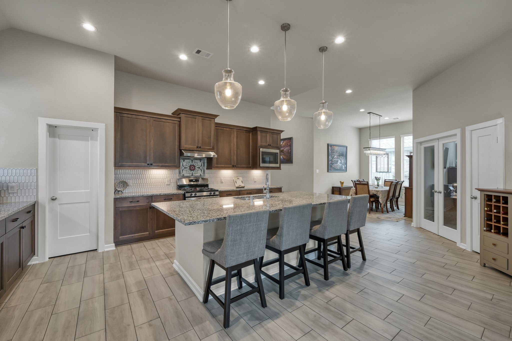111 Yellow Perch Way Conroe, TX 77318 - Photo 9 of 35 Expansive island kitchen overlooking the main living area.