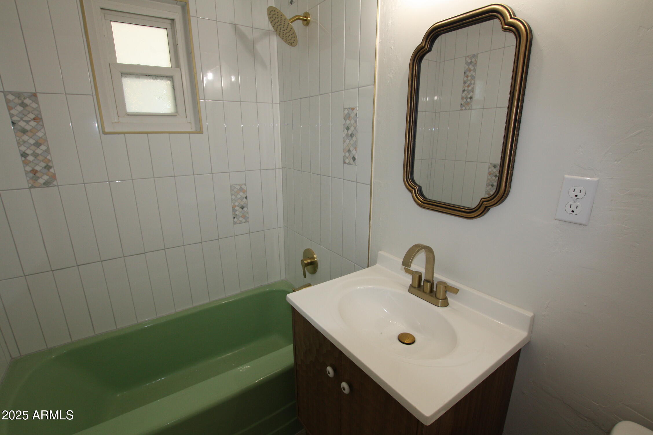 1333 East Flower Street Phoenix, AZ 85014 - Photo 13 of 20 a bathroom with a sink and a mirror
