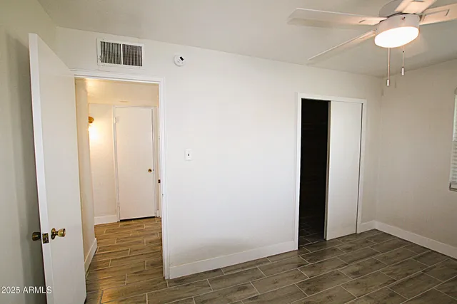 a view of a bathroom with wooden floor