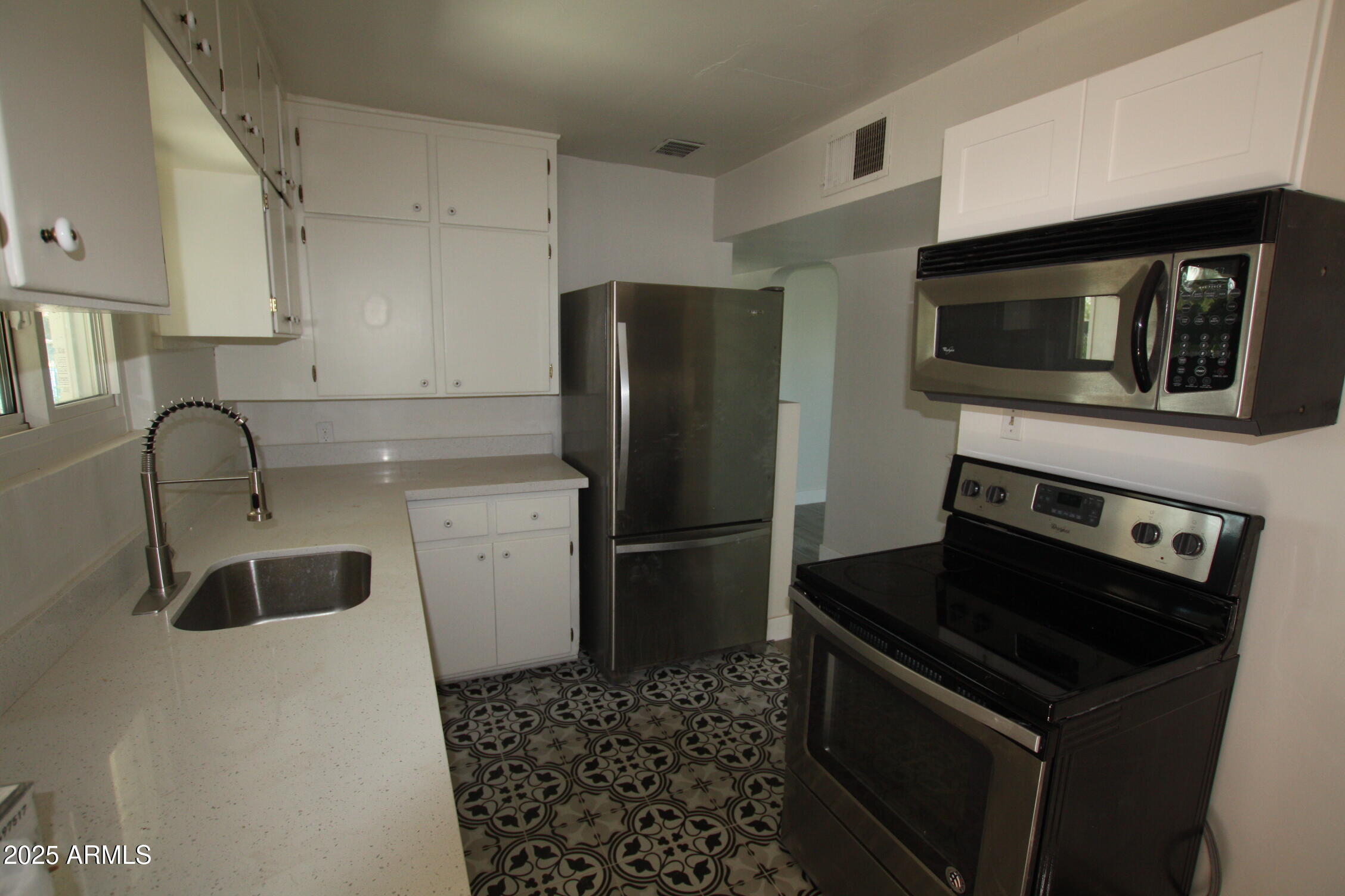 1333 East Flower Street Phoenix, AZ 85014 - Photo 20 of 20 a kitchen with a refrigerator stove and sink
