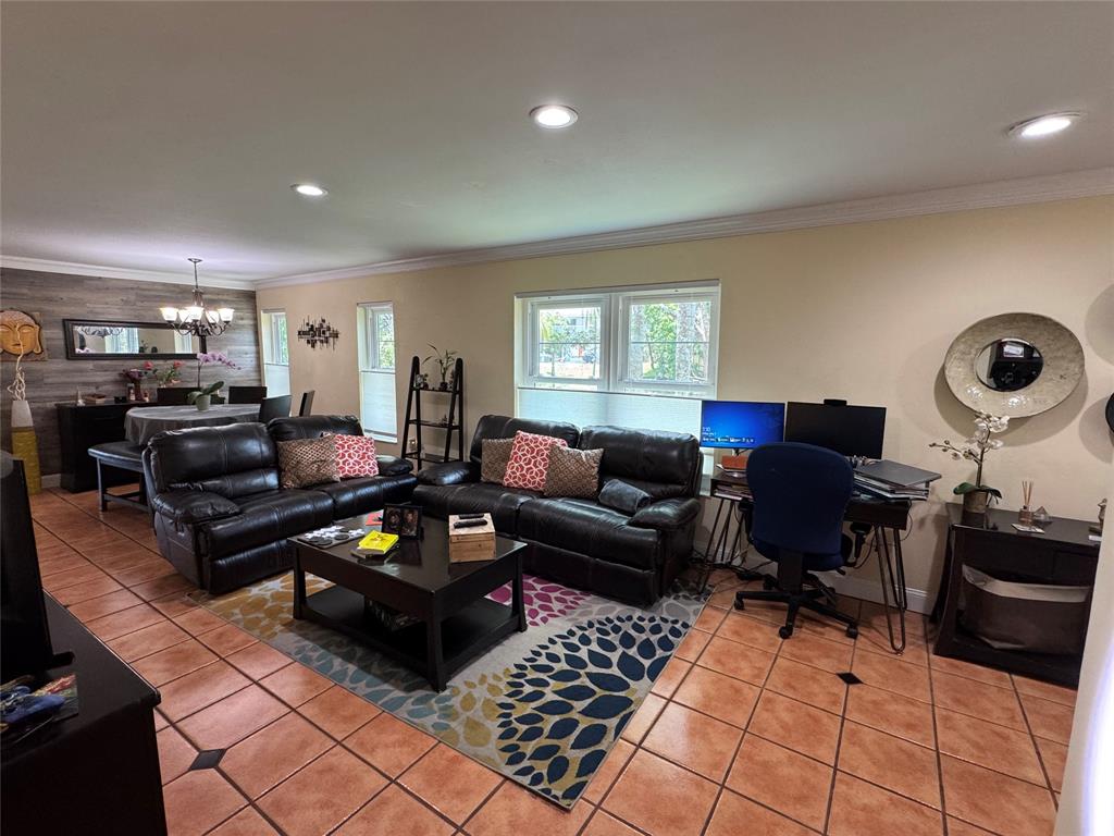 718 Southwest 88th Terrace, Unit 718 Plantation, FL 33324 - Photo 11 of 37 a living room with furniture and a rug