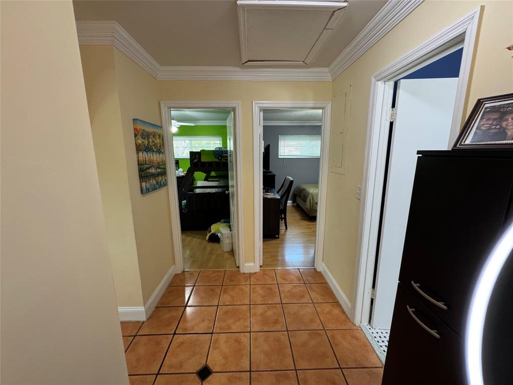 718 Southwest 88th Terrace, Unit 718 Plantation, FL 33324 - Photo 17 of 37 a hallway with a view of living room