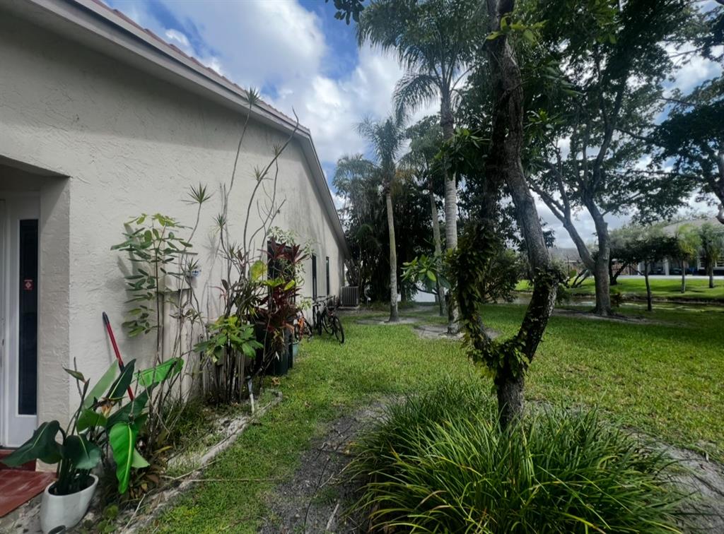 718 Southwest 88th Terrace, Unit 718 Plantation, FL 33324 - Photo 19 of 37 a view of a garden with plants