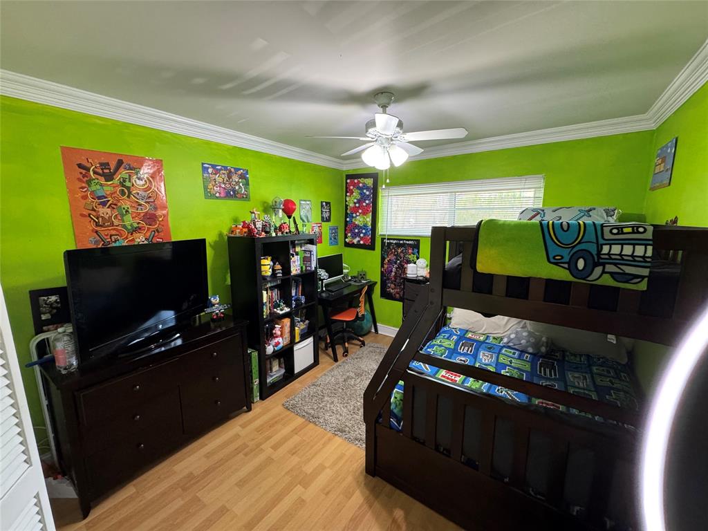 718 Southwest 88th Terrace, Unit 718 Plantation, FL 33324 - Photo 23 of 37 a living room with furniture and a flat screen tv