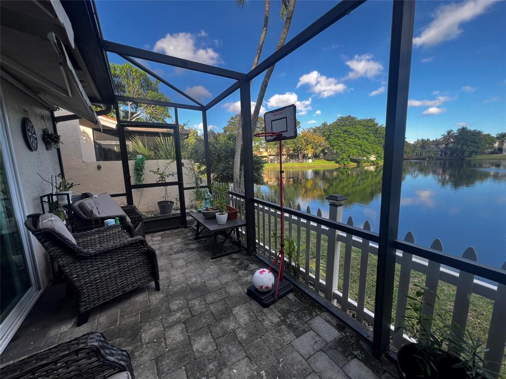 718 Southwest 88th Terrace, Unit 718 Plantation, FL 33324 - Photo 3 of 37 a view of a porch with furniture