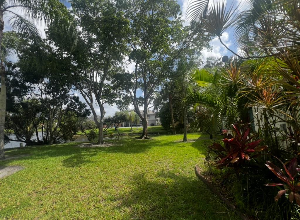 718 Southwest 88th Terrace, Unit 718 Plantation, FL 33324 - Photo 34 of 37 a view of a park with large trees