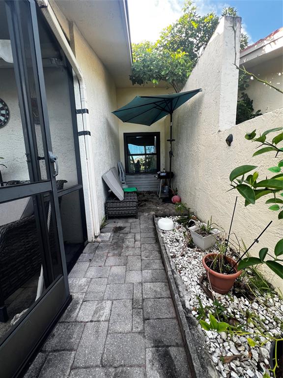 718 Southwest 88th Terrace, Unit 718 Plantation, FL 33324 - Photo 36 of 37 a view of a backyard of the house