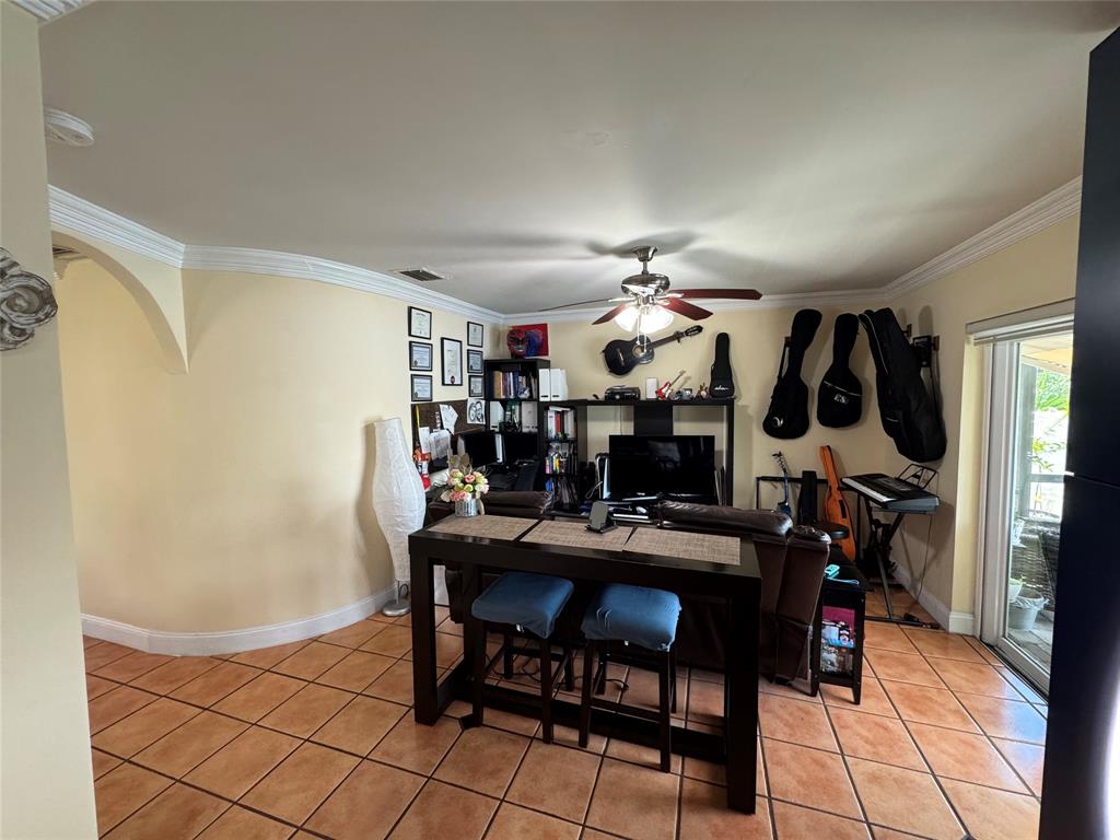 718 Southwest 88th Terrace, Unit 718 Plantation, FL 33324 - Photo 7 of 37 a view of a dining room with furniture and chandelier