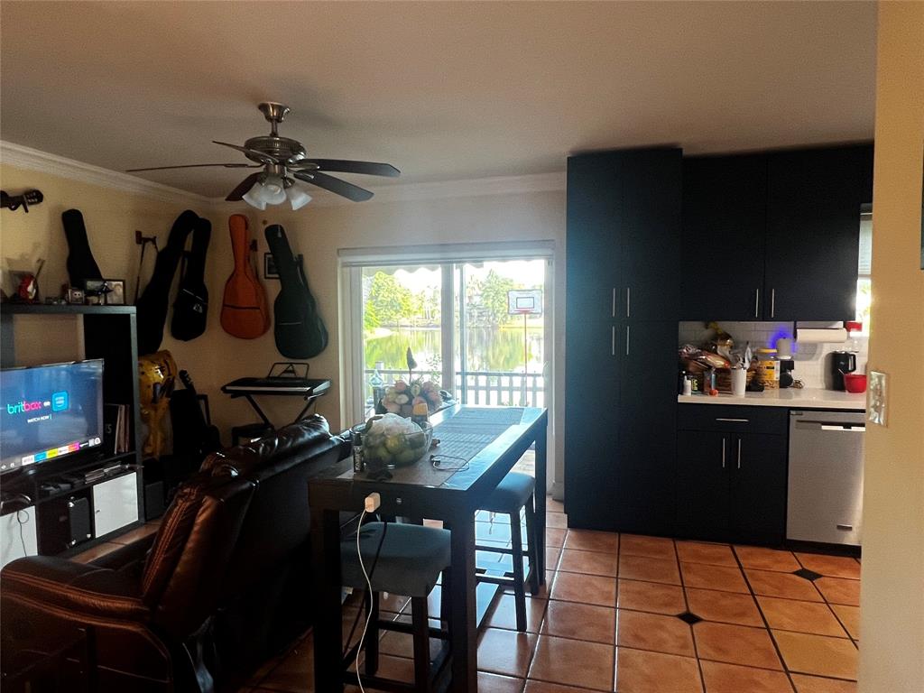 718 Southwest 88th Terrace, Unit 718 Plantation, FL 33324 - Photo 9 of 37 a view of a dining room with furniture and a window