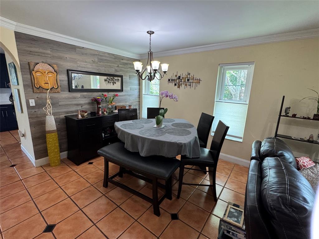718 Southwest 88th Terrace, Unit 718 Plantation, FL 33324 - Photo 10 of 37 a view of a dining room with furniture