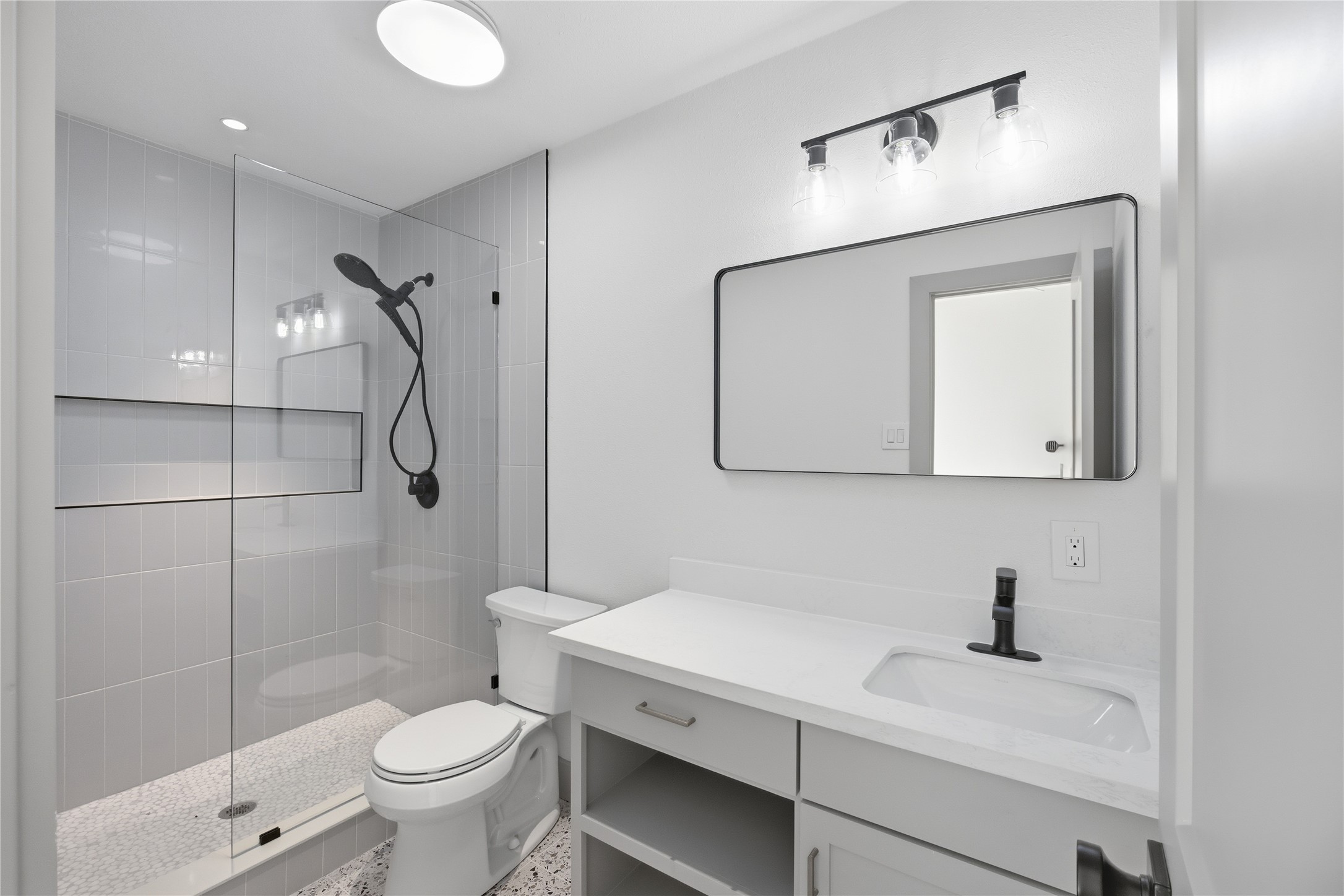 1415 Tabor Street Houston, TX 77009 - Photo 17 of 31 a bathroom with a sink toilet and shower