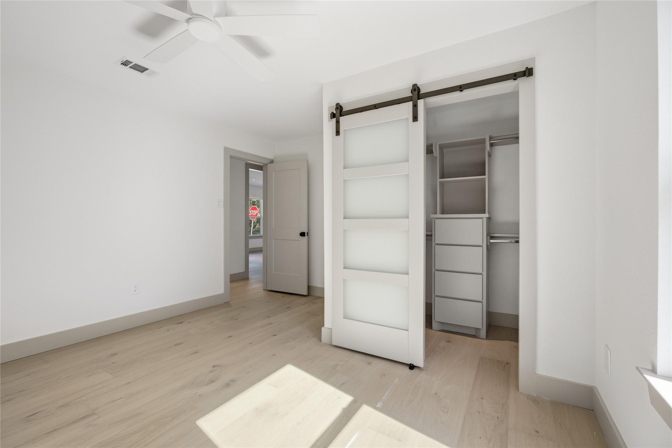 1415 Tabor Street Houston, TX 77009 - Photo 19 of 31 an empty room with closet and mirrors