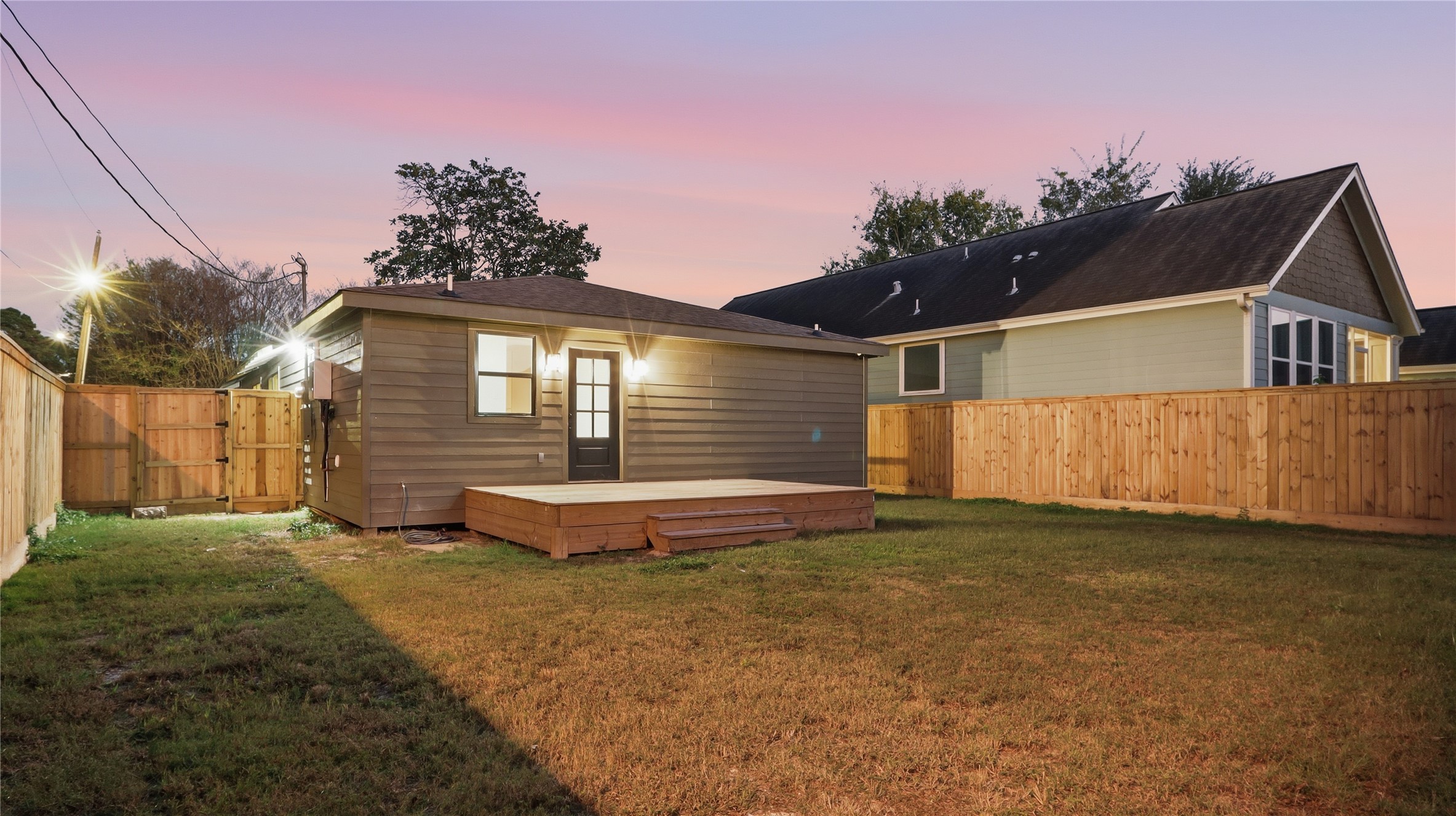 1415 Tabor Street Houston, TX 77009 - Photo 20 of 31 a front view of a house with a yard and garage