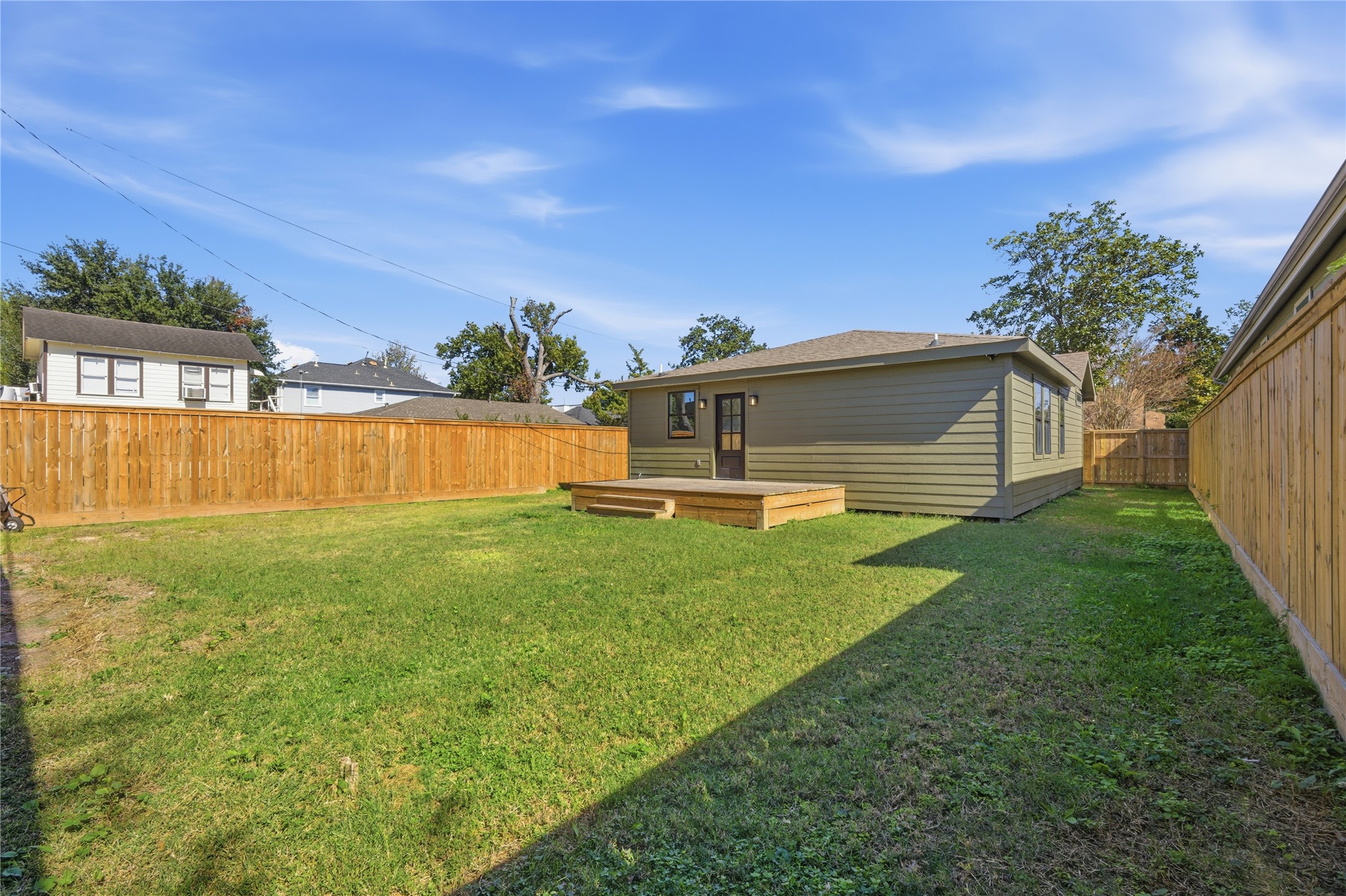 1415 Tabor Street Houston, TX 77009 - Photo 21 of 31 a view of a backyard with a garden